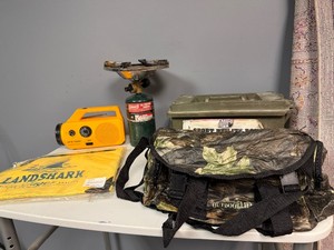 Sportsmans Finds Coleman Propane Burner, Sport Utility Box, Mossy Oak Collapsible Bag, Battery Operated RadioFlashlight, Landshark Lager Bag