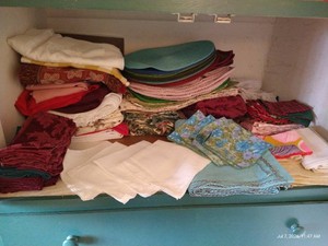 Shelf of Table Linens, Placemats, Napkins, Etc.
