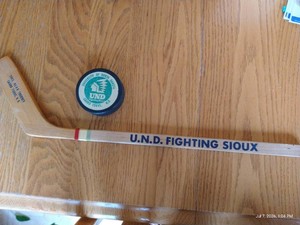 Old UND Fighting Sioux Hockey Puck & Small Decorative Wooden Hockey Stick