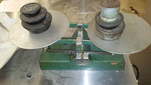 Vintage Dual-Pan Balance Scale with Weights.