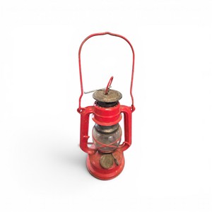 vintage red Feuerhand hurricane lantern, specifically the Nier-Patent Feuerhand No. 175 Super Baby model