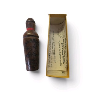 Vintage Mallardtone duck call made from walnut wood.