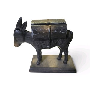 Antique novelty cigarette dispenser features a cast metal donkey mounted on a wooden plinth Valued at $175