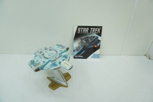 Star Trek Deep Space Nine U.S.S. Defiant NX-74205 Model and Book. Stands about 8.5 tall