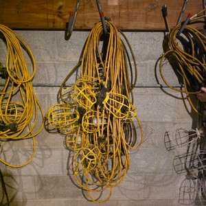 Lot of Extension Cords and Yellow Cage Work Lights