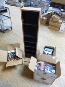 Tower Cabinet with DVDs and VHS Tapes