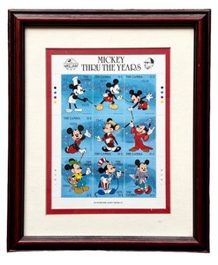 G - Framed Mickey Thru the Years Stamp Art the Gambia