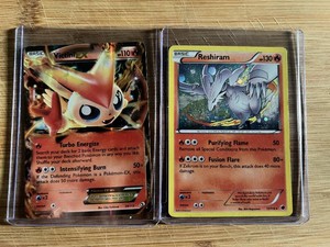 These are Pokemon trading cards featuring Victini-EX and Reshiram Holo Cards