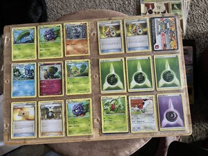Lot of Pokemon Trading Cards including Tangela, Karrablast, Shellos, and Assorted Trainer and Energy Cards