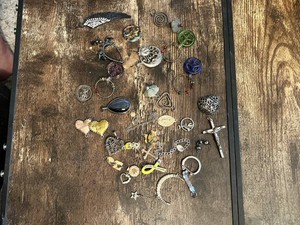 Assorted Charms and Pendants Including Crosses, Hearts, and Symbols