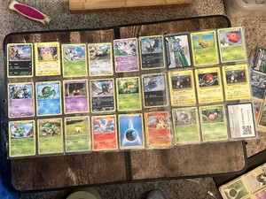 Lot of Pokemon Trading Cards including Grass, Psychic, Fire, and Electric Types