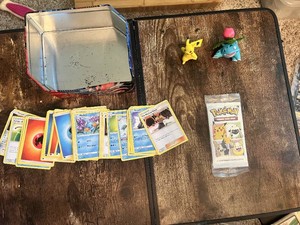 Pokemon Trading Card Game Tin with Cards, Pack, and Figures