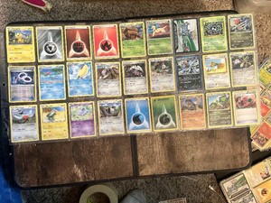 Lot of 54 Pokemon Trading Cards including Energies, Trainers, and Pokemon Characters.