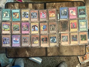 Lot of Yu-Gi-Oh Trading Cards including Harpie Lady, Red-Eyes Dragon, and others
