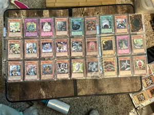 Lot of Yu-Gi-Oh Trading Cards Including Various Monster, Spell, and Trap Cards, Cyber Dinosaur, Toon Mermaid and More