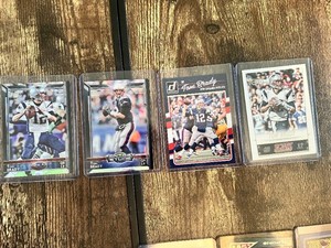 Lot of 4 Tom Brady Football Cards featuring Donruss and Score with Fantasy Studs and Patriots Highlights.