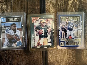 Lot of 3 Football Cards Featuring Peyton Manning, Brett Favre, and Ezekiel Elliott Rookie.