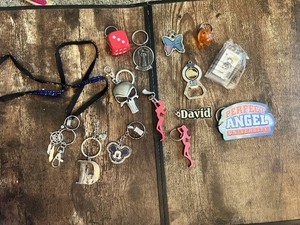 Collection of Keychains and Accessories Including Dice, Skull, and Name Tag Keychains Various Designs Miscellaneous