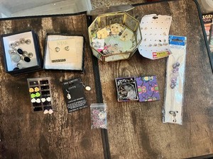 Assorted Jewelry Collection Including Earrings, Charms, and Accessories