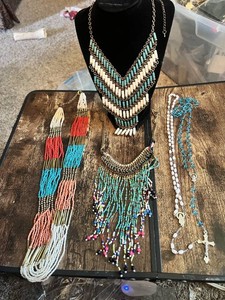 Collection of beaded necklaces and rosaries including multicolored designs