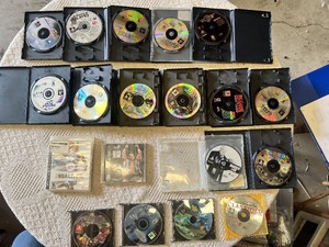 Multiple video games for PlayStation with titles such as Madden 99, Twisted Metal, and NBA Live 10.