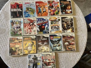 Collection of Nintendo Wii Video Games including Red Steel, NBA 2K11, and Call of Duty World at War