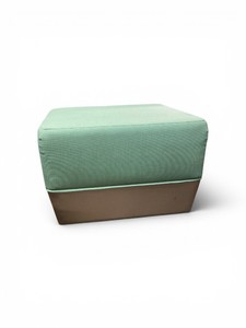 green and gray modern cube ottoman features a textured upholstered top and a leather base