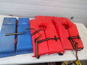 4 Life Jackets and 2 Hull Hugger Boat Bumpers
