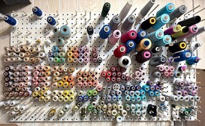 Assorted Thread Spools on Pegboard including T.S. Colour Art Silk