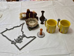 Minnesota Themed Home Decor Lot Including Metal Wall Art, Nordic Ware Cookie Stamp, and Menards Coffee Cups