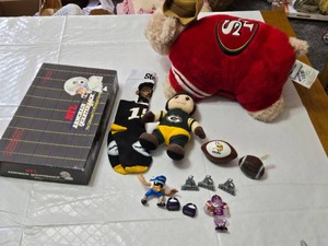 Assorted NFL Memorabilia including Armchair Quarterback Board Game (uncounted), 49ers Plush Toy, and Various Collectible Figurines