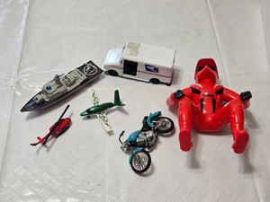 Assorted Toy Vehicles and Figure Set including Motorbike, Helicopter, Plane, Boat, USPS Van, and Red Yamaha Figure