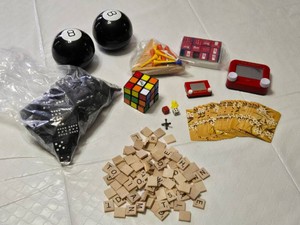 Collection of Classic Toys and Games including Dominoes, Rubiks Cube, Magic 8-Balls, and Etch A Sketch