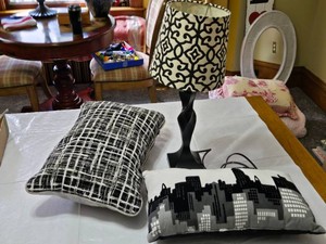 Black and White Table Lamp, Pillows with Cityscape and Geometric Patterns