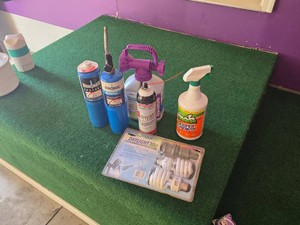Various Cleaning and Lighting Supplies including Bernzomatic Propane Tanks, Rejuvenate House Wash, and Daylight Light Bulbs