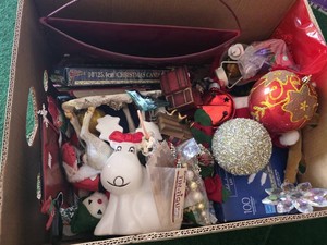 Box of assorted holiday decorations and ornaments