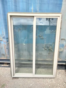 Vinyl sliding window features a desert sand color