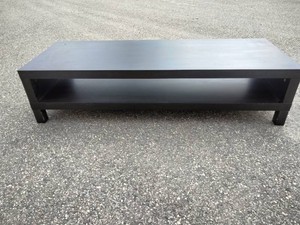 This is an LACK TV unit in black with a minimalist, open-shelf design