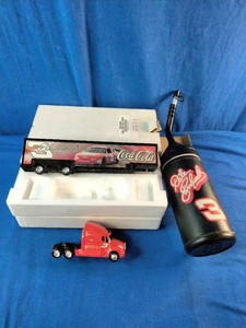 164 scale Action Racing diecast set featuring a Dale Earnhardt #3 Coca-Cola Kenworth transporter hauler.