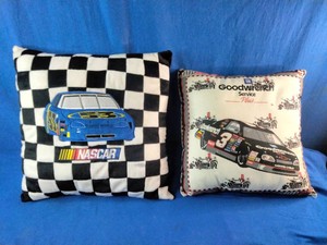 These vintage 90s NASCAR throw pillows feature a checkered flag design with a blue #53 car and a white design highlighting a Goodwrench #3 Chevrolet Monte Carlo