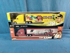 Winners Circle 164 scale NASCAR die-cast trailer rigs featuring the #38 M&Ms car driven by Elliott Sadler and the #9 car driven by Kasey Kahne