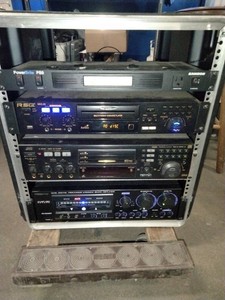This is a professional karaoke equipment rack containing various audio components.
