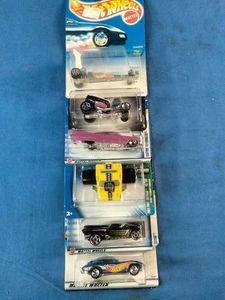 This collection contains a variety of vintage and specialized Mattel Hot Wheels carded die-cast cars spanning from the late 1990s through the mid-2000s.