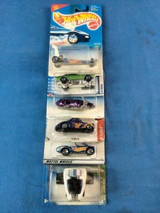 Stacked collection of vintage Mattel Hot Wheels die-cast vehicles