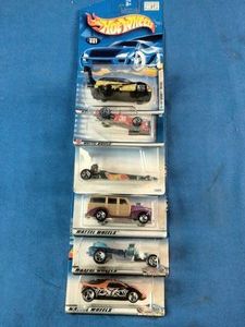 Six classic Mattel Hot Wheels carded die-cast cars.
