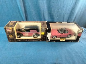 Pair of vintage die-cast vehicle collectibles in their original window display boxes.