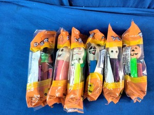 Collection of factory-sealed PEZ Halloween candy dispensers