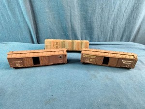 Athearn HO Scale freight cars, featuring a Southern Pacific boxcar and an automobile boxcar