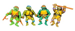K - Four Vintage Teenage Mutant Ninja Turtles Action Figures