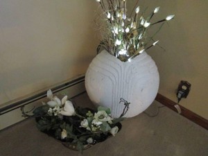 Heavy ceramic vase with lighted arr...